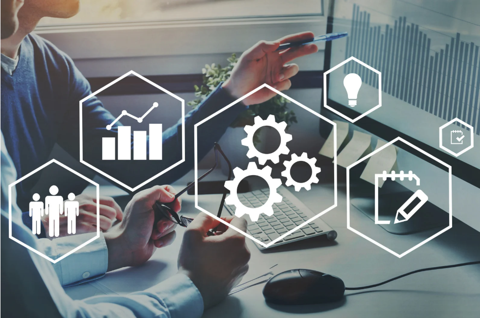 Revenue operations consulting workflow icons over a team working at a desk