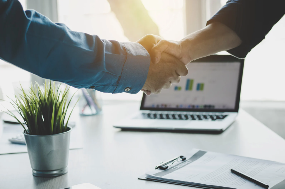 Handshake sealing a fixed-scope revenue operations engagement